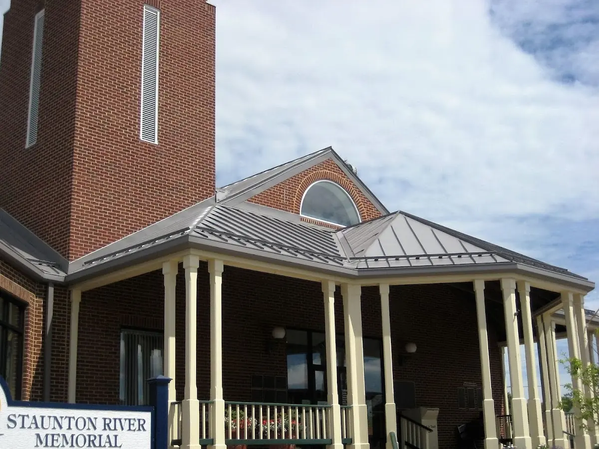 Skilled roofing craftsmen working on a residential roof in North Weymouth